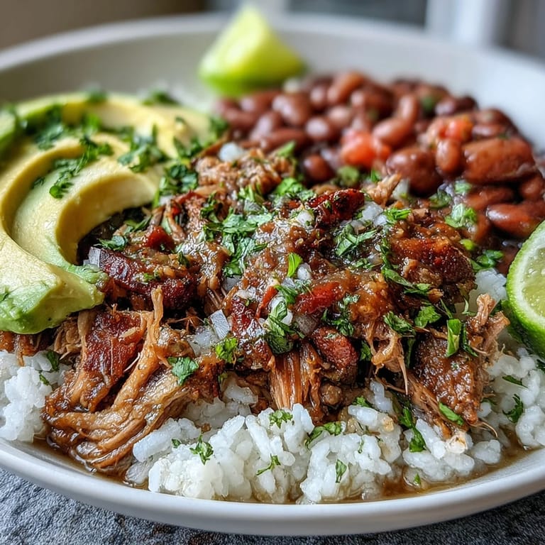 Served in a rustic ceramic bowl, this gluten-free Carnitas Bowl combines savory slow-cooked pork with fluffy rice and bright fresh salsa for a satisfying dinner.